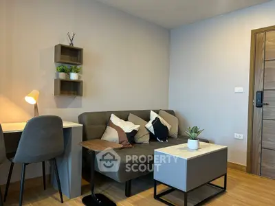 Modern living room with cozy sofa, stylish decor, and natural light.