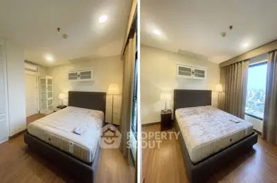 Spacious bedroom with city view and modern furnishings in a high-rise apartment.
