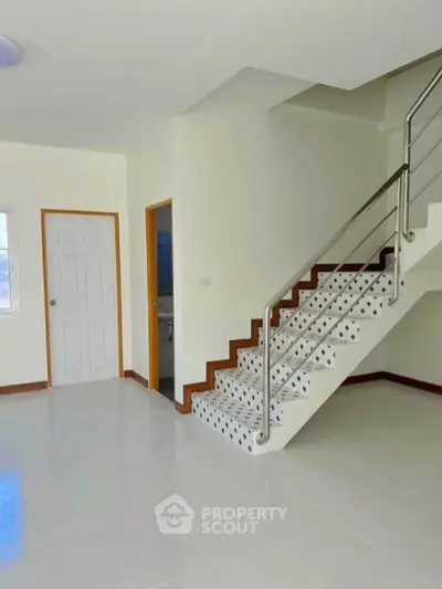 Modern interior with sleek staircase and minimalist design