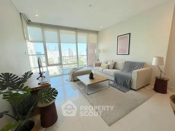 Spacious modern living room with large windows and city view