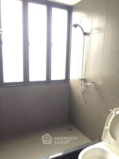 Modern bathroom with large windows and sleek shower design