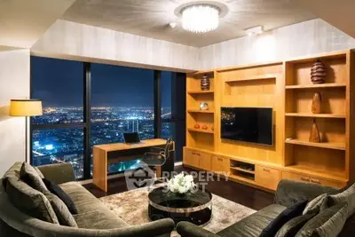 Luxurious living room with stunning city view, elegant furniture, and modern decor.