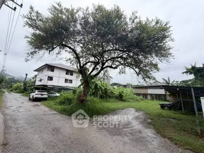 Charming rural property with lush greenery and spacious surroundings, perfect for serene living.