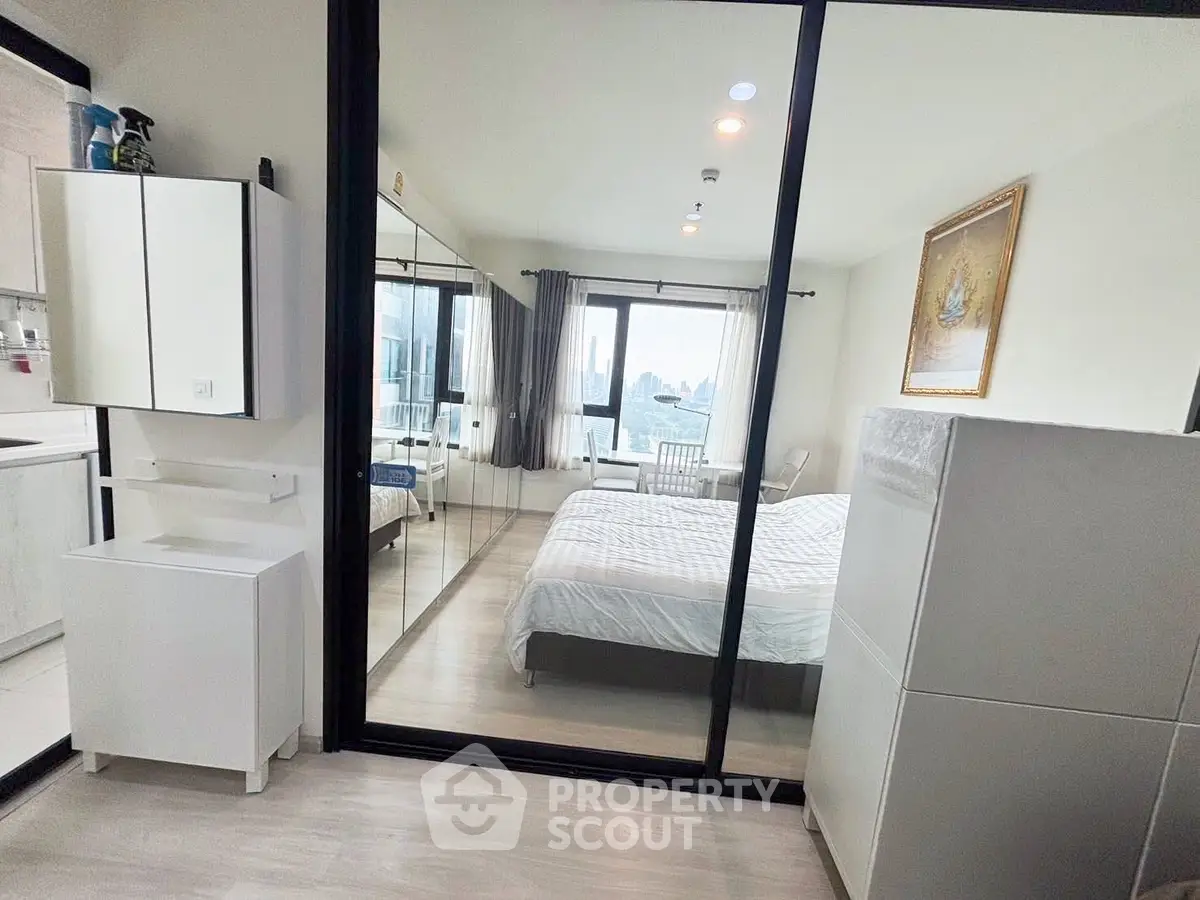 Modern bedroom with glass partition and city view in stylish apartment