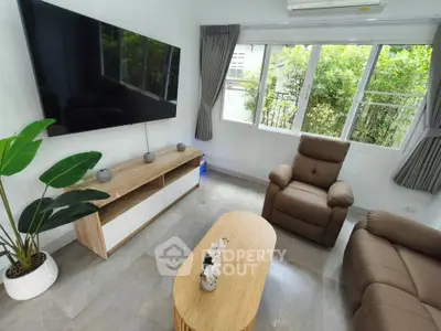 Cozy living room with modern furniture and large window view