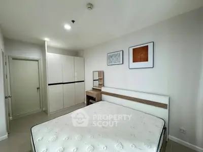 Modern bedroom with minimalist design and ample storage space