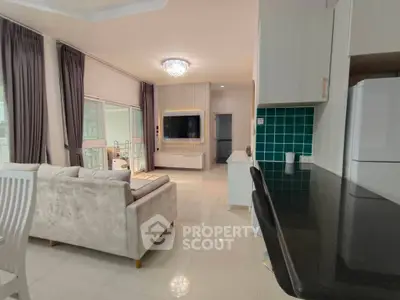 Spacious modern living room with elegant decor and open kitchen layout