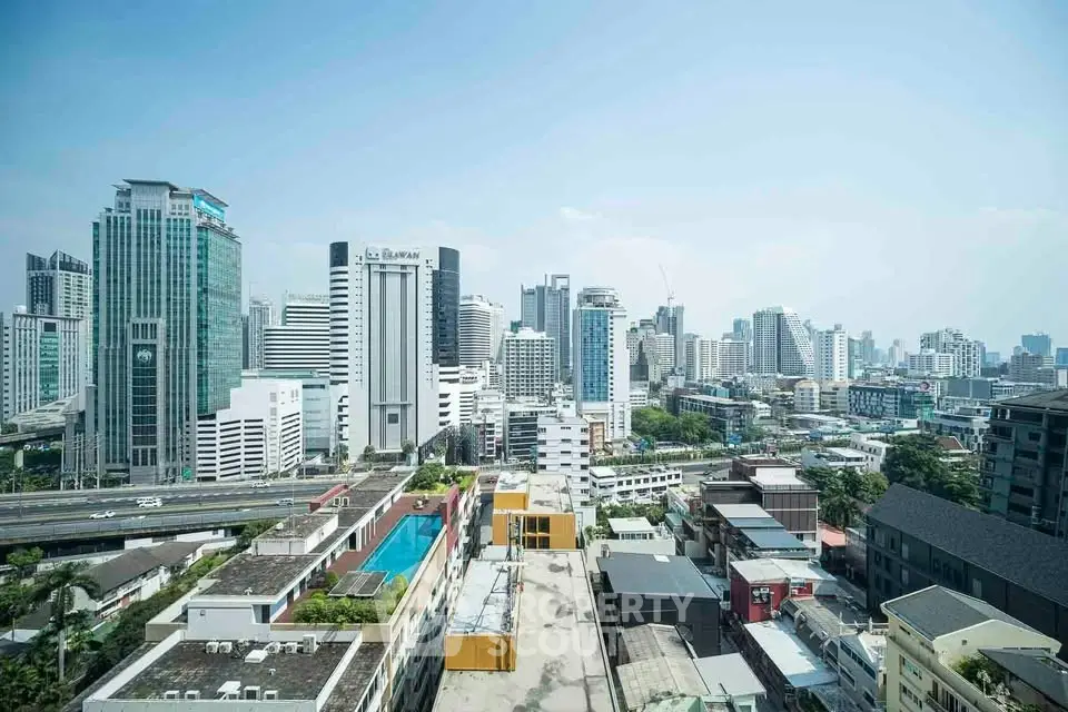 Stunning cityscape view from high-rise building showcasing urban skyline and modern architecture.