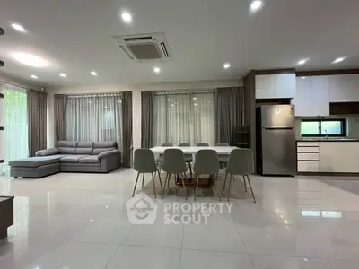 Spacious modern living room with open kitchen and elegant dining area