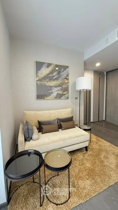 Modern living room with stylish decor and cozy seating area, perfect for relaxation and entertaining.