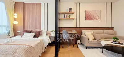 Modern studio apartment with stylish decor, featuring a cozy bed, elegant sofa, and functional workspace.