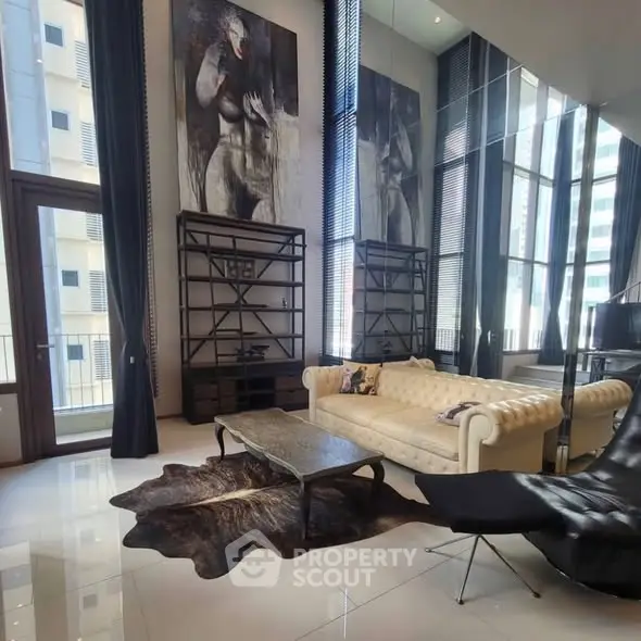Luxurious modern living room with high ceilings, large windows, and elegant decor in a high-rise apartment.