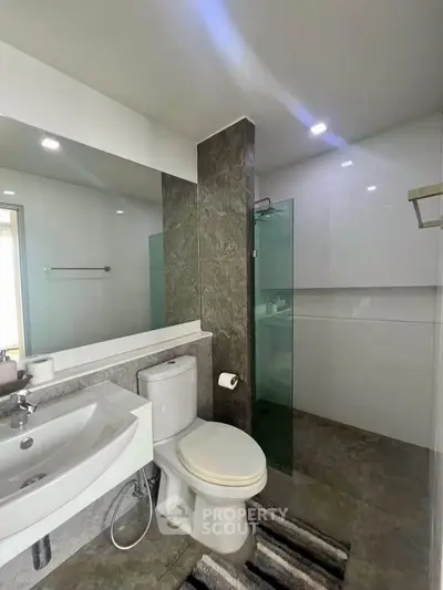 Modern bathroom with sleek design and glass shower enclosure