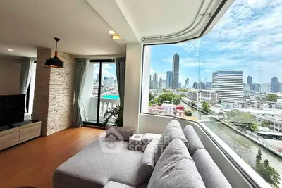 Spacious living room with panoramic city view and modern decor