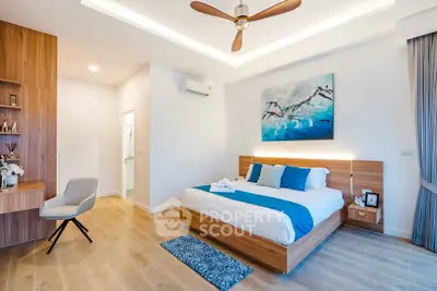 Modern bedroom with stylish decor and wooden accents, featuring a cozy bed and elegant lighting.