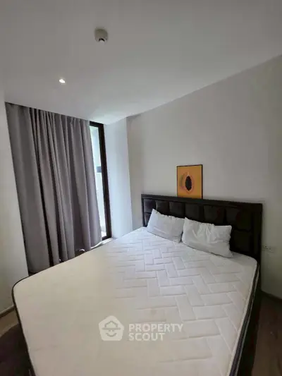 Modern bedroom with large bed and minimalist decor