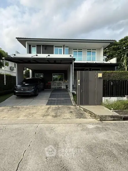 Modern two-story house with carport and landscaped front yard in a suburban neighborhood.