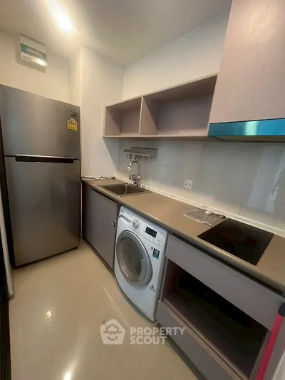 Modern kitchen with sleek appliances and ample storage space