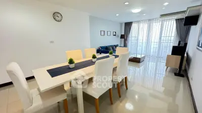 Spacious modern living room with dining area and large windows