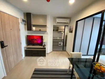 Modern living room with open kitchen and stylish decor