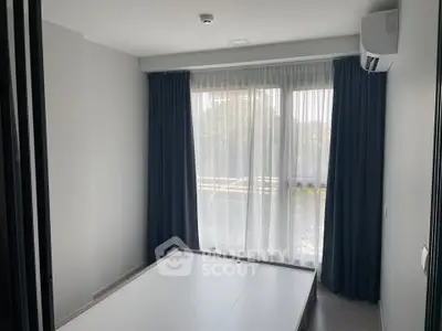 Modern bedroom with large window and air conditioning unit