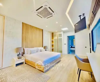 Luxurious modern bedroom with stylish decor and ample natural light