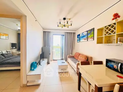 Modern living room with stylish decor and balcony view in a contemporary apartment.