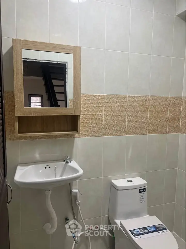 Modern bathroom with sleek fixtures and neutral tile design