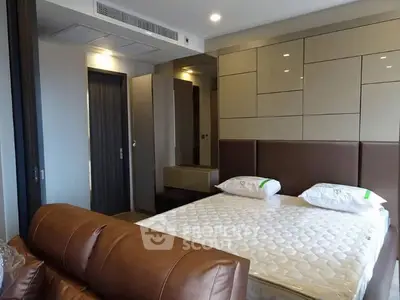 Modern bedroom with stylish decor and comfortable furnishings in a contemporary apartment.