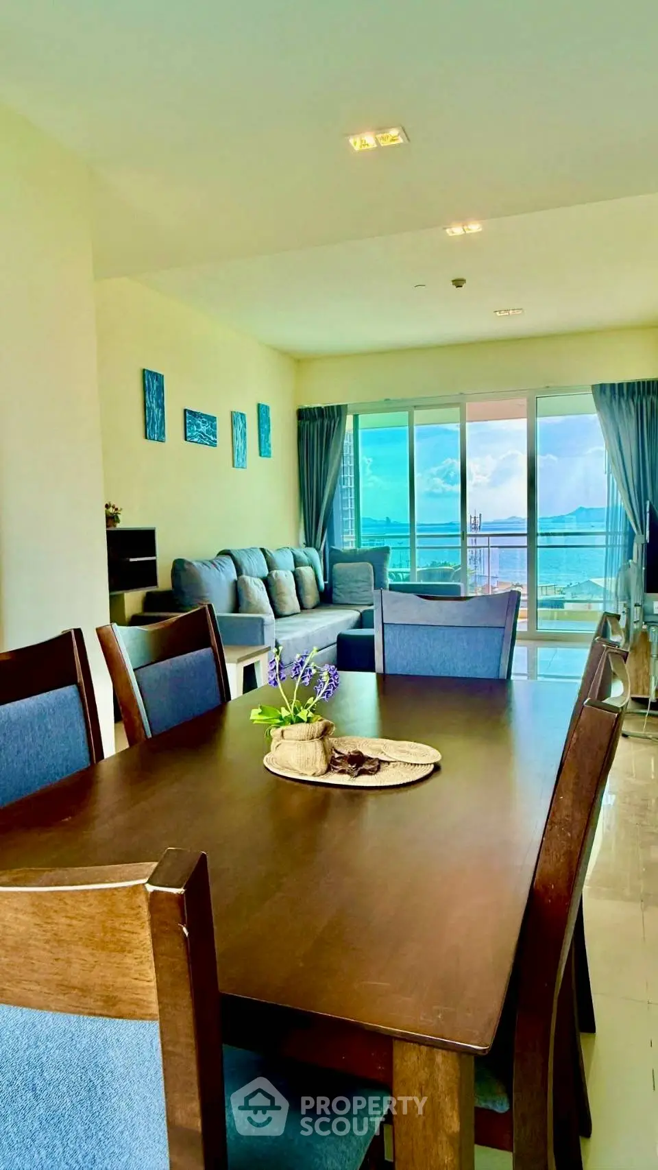 Spacious living room with ocean view and elegant dining area