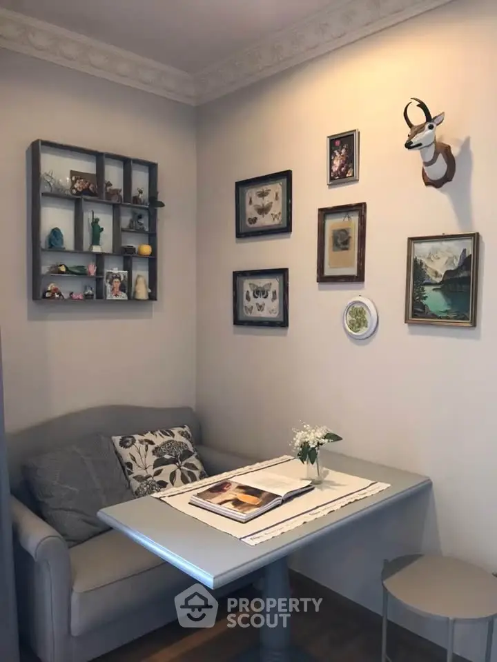 Cozy study nook with wall art and comfortable seating