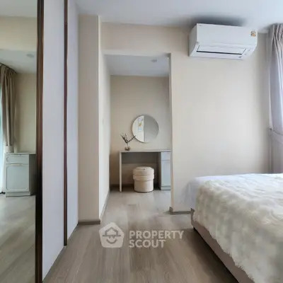 Modern bedroom with minimalist decor and air conditioning unit