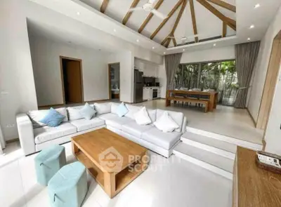 Spacious modern living room with open kitchen and stylish wooden accents