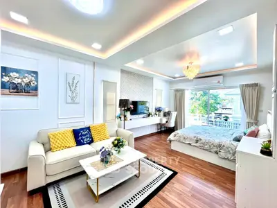 Spacious open-plan living room with elegant decor and natural light