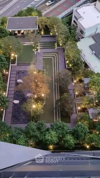 Stunning aerial view of modern urban garden with lush greenery and elegant pathways.