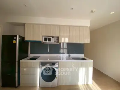 Modern kitchen with sleek cabinetry, built-in appliances, and ample storage space.
