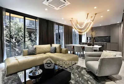 Luxurious modern living room with open kitchen and elegant lighting