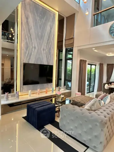 Luxurious modern living room with high ceilings and elegant decor
