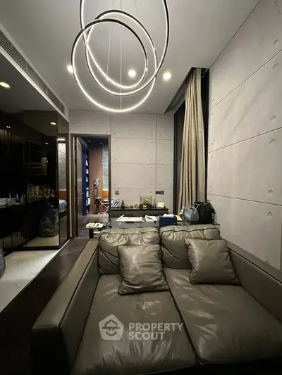Luxurious modern living room with stylish lighting and leather sofa, perfect for urban living.
