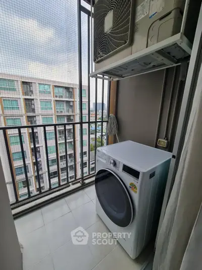 Modern apartment balcony with washing machine and city view