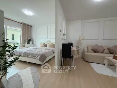 Modern studio apartment with cozy bedroom and stylish living area