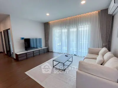 Spacious modern living room with elegant decor and natural light