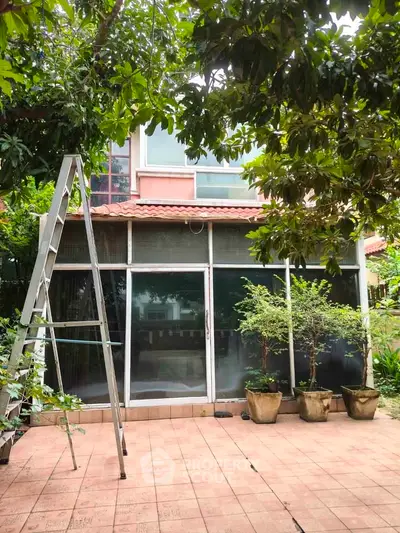 Charming residential property with lush garden and patio, perfect for outdoor relaxation.