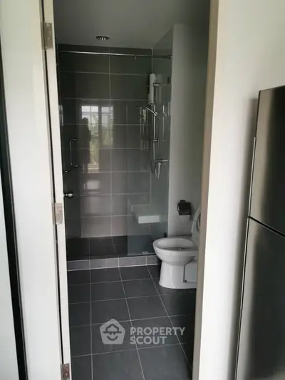 Modern bathroom with sleek gray tiles and contemporary fixtures