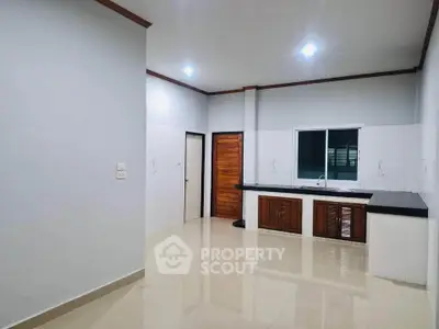 Spacious kitchen with modern design and ample counter space in a bright, open layout.