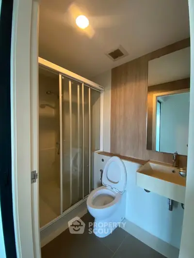 Modern bathroom with shower and sleek fixtures in contemporary apartment