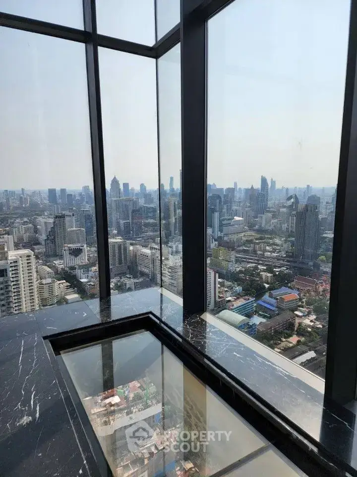Stunning high-rise view from a luxurious corner unit with floor-to-ceiling windows.