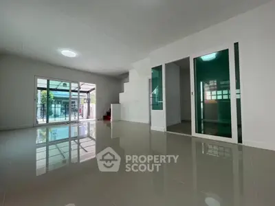Spacious modern living room with glossy floors and large windows