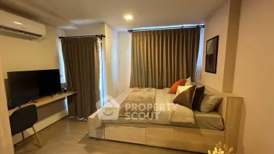 Cozy bedroom with modern decor and natural light, featuring a comfortable bed and stylish furnishings.