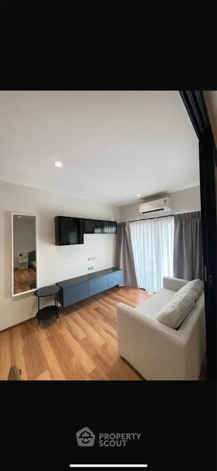 Modern living room with sleek furniture and natural light